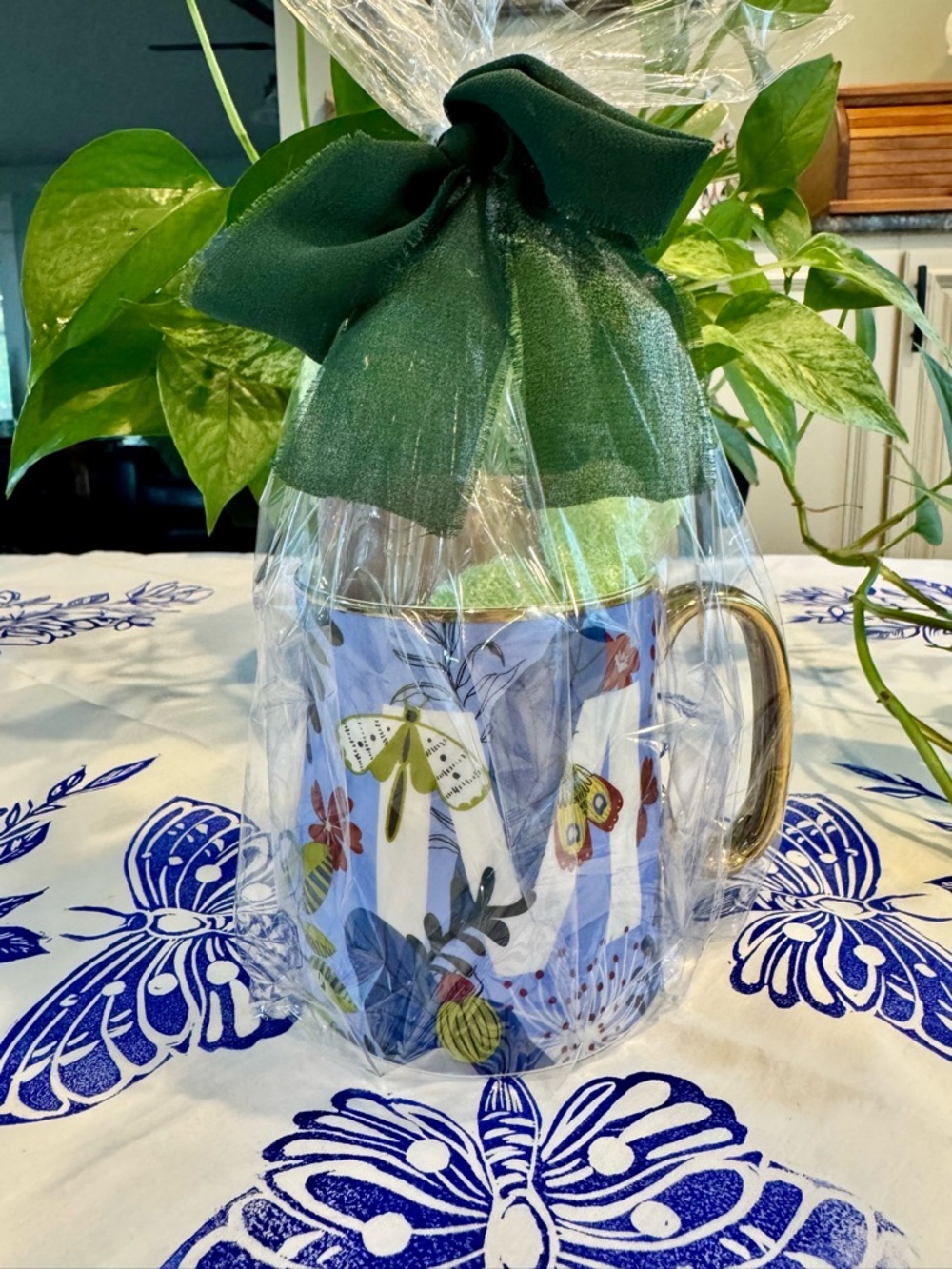 Ceramic Mug with Gold accents stuffed with Latt soap and bliss exfoliate gloves